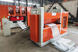 Expanded mesh flattening machine